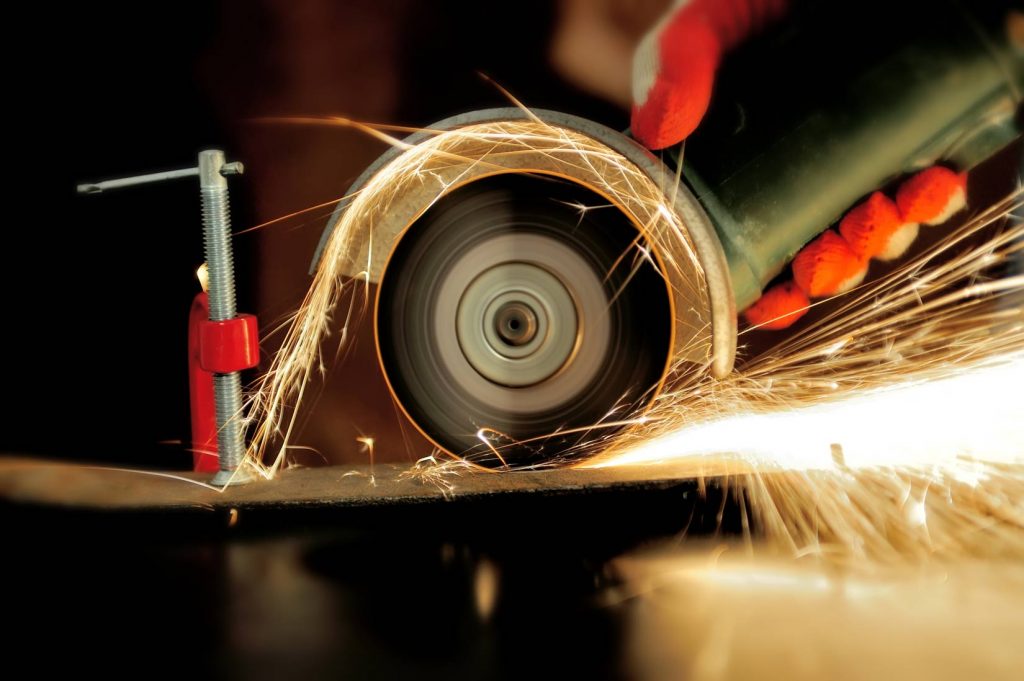 worker-cutting-metal-with-grinder