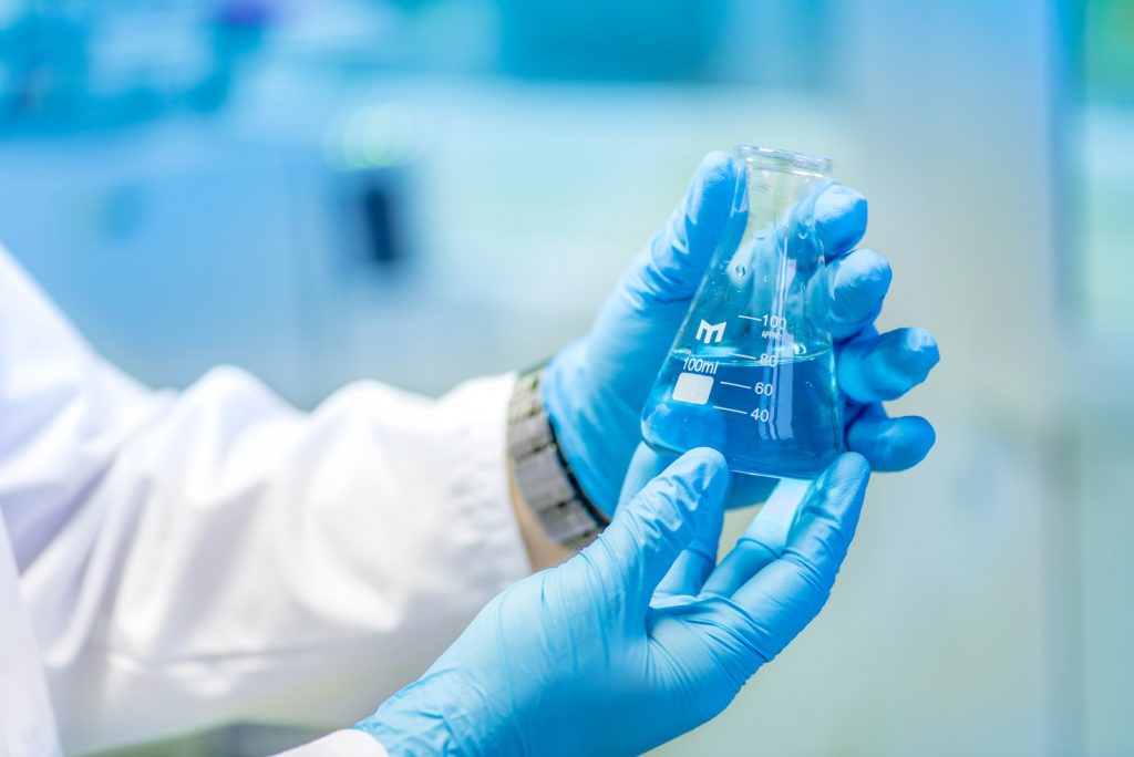 doctor holding test tube flask