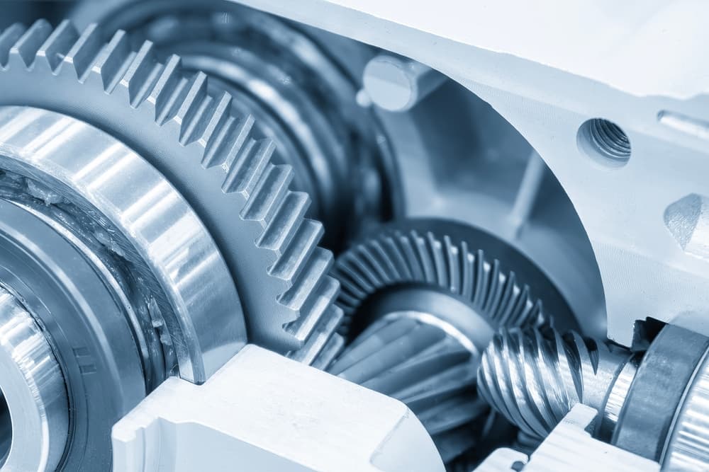 Precision industrial gears inside heavy machinery used in manufacturing operations
